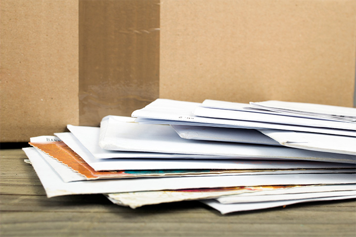 a pile of paper documents on the floor