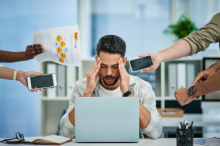 Man overwhelmed by tasks and under time pressure