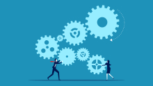 Business woman and man connecting gears.