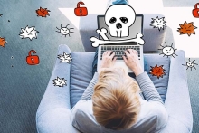 image of a man in front of a computer with danger and warning symbols