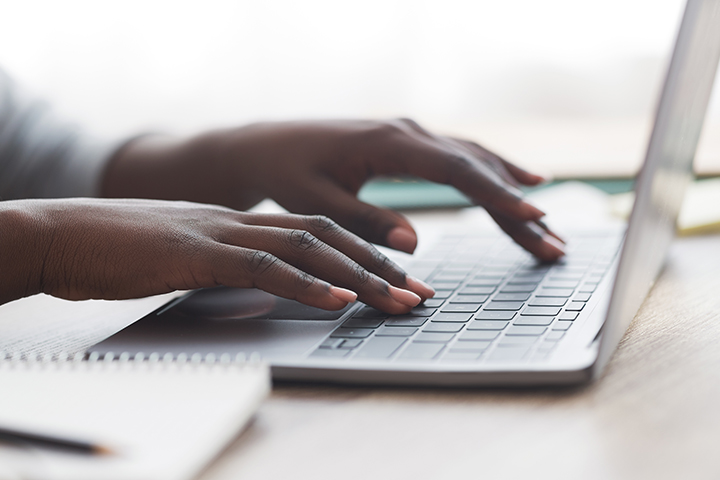person-typing-on-laptop-keyboard