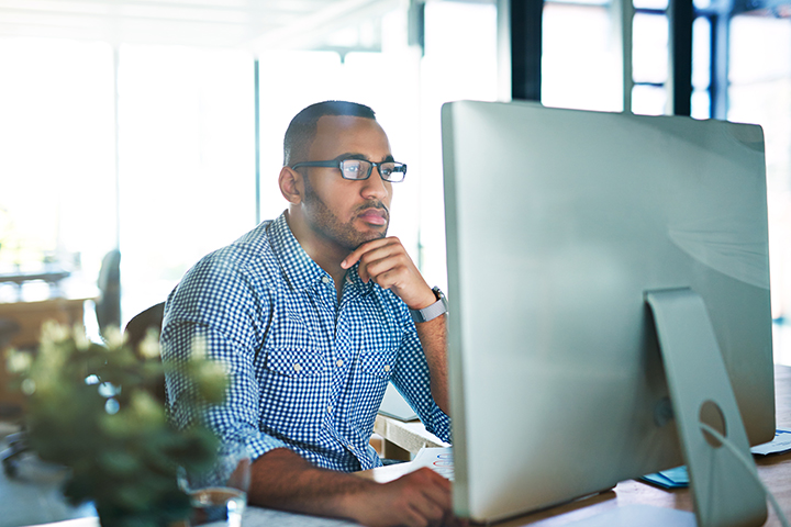 shot of young businessman working in his office shot of young businessman working in his office