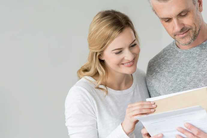 Couple looking at an envelope