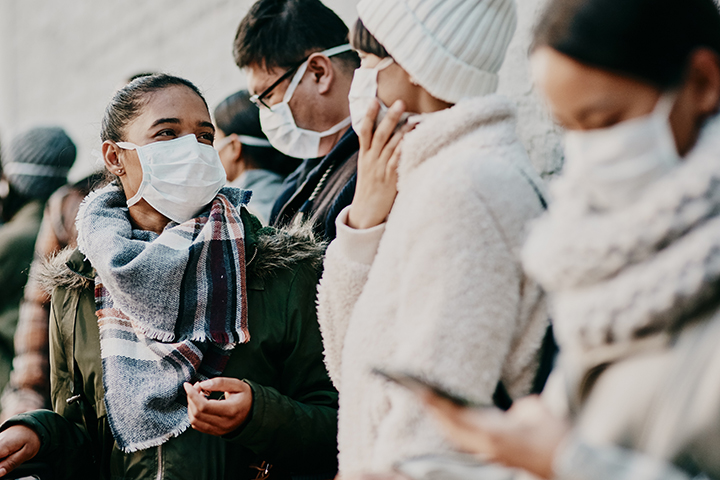 crowd of people wearing masks