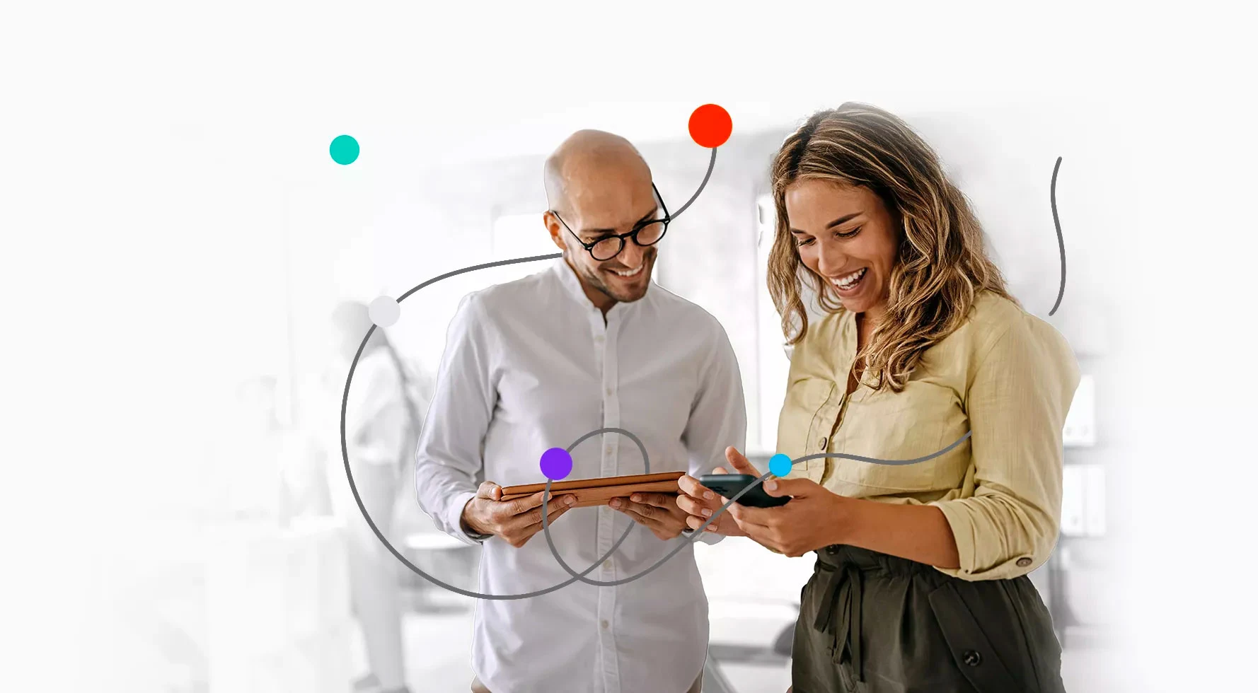 two people looking at a tablet