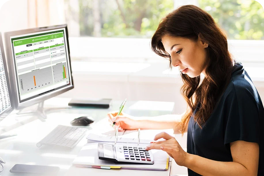 a woman using a calculator a woman using a calculator