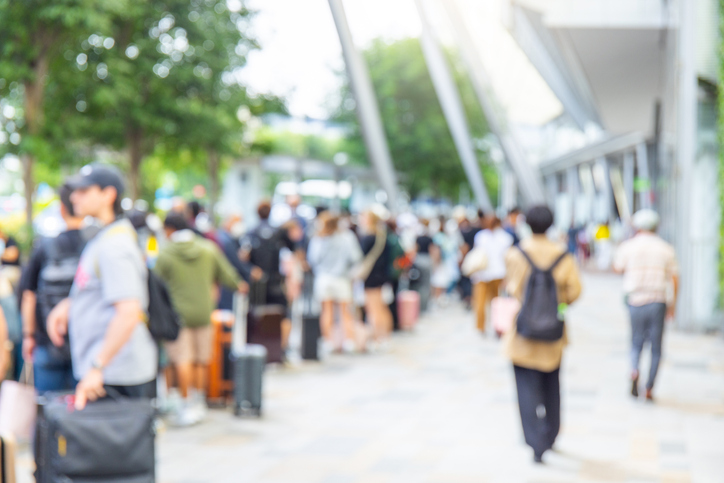 image showing people queuing for an event