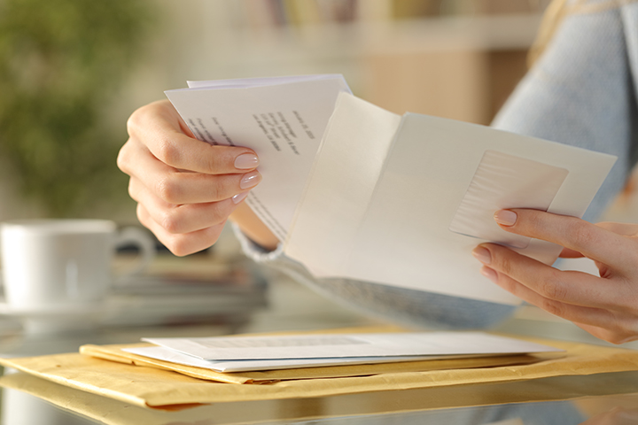 person opening letters
