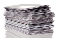Stack of envelopes and office mail, representing postage meter use for high-volume mailing, postage processing, and mailroom efficiency.
